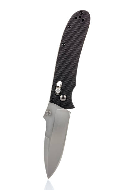istock Folding pocket knife with open satin blade and textured black composite plastic cover plates on steel handle isolated on white background. Pocket knife close-up image 1226092855