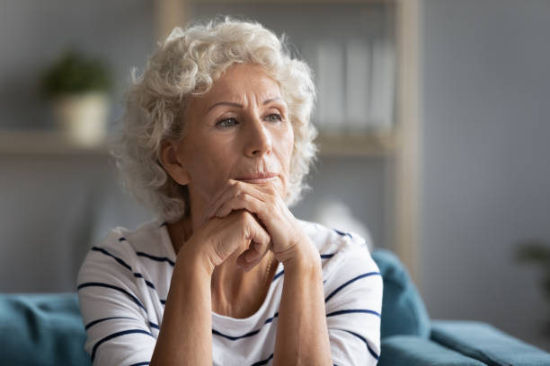 istock Thoughtful middle aged elder woman put head on hands. 1226093689