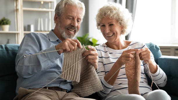 istock Happy older grandparents enjoying hobby activity at home. 1226093748