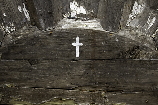 Cross sign on a wood, detail of religious sign, Christianity and faith