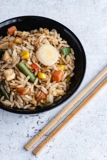 istock Chinese Vegetable Fried Rice and eggs served in a bowl with chopsticks. Chinese Cuisine 1226098794