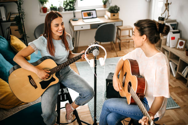 istock Guitar band making a rehearsal at home. 1226102994
