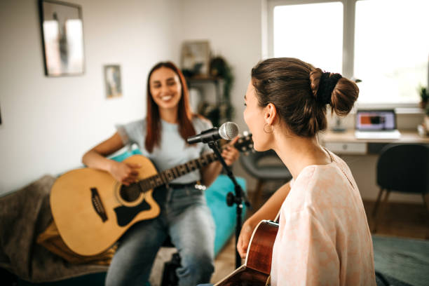 istock Singing a new song. Band rehearsal in studio. 1226103059