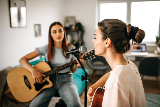 istock Singing a new song. Band rehearsal in studio. 1226103767
