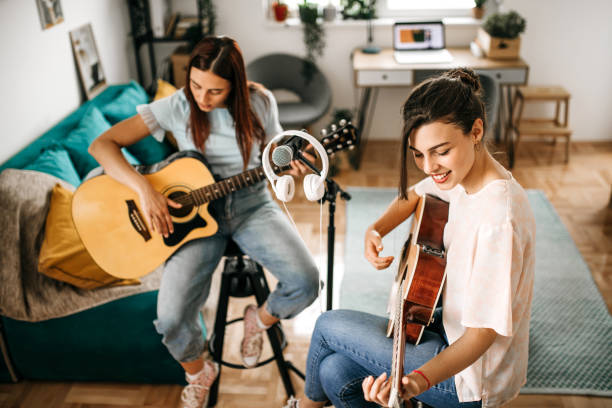 istock Guitar band making a rehearsal at home. 1226103798