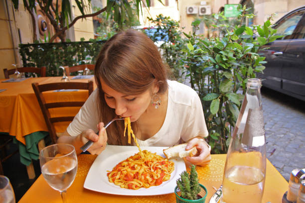 istock A woman eating pasta. 1226103982