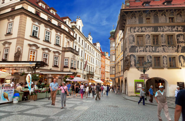 Prague, Czech Republic - September 08, 2016: Tourists in Stare Mesto Square with Old Town Tower and Tyn Church, main attraction of Prague