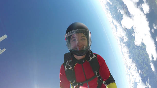 istock Female skydiver falls through clear skies, aerial flight 1226105682