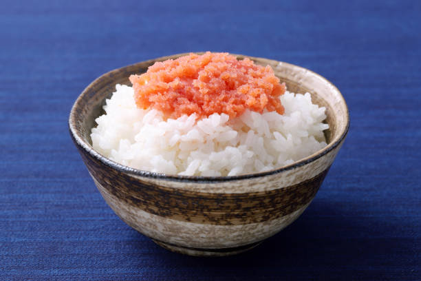 Japanese cooked white rice with karashi mentaiko in a bowl on table