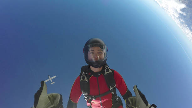 istock Female skydiver falls through clear skies, aerial flight 1226105806