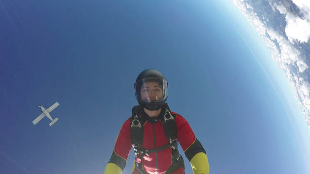 istock Female skydiver falls through clear skies, aerial flight 1226105822