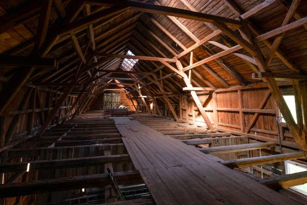istock Interior of large old timber frame barn in Germany during renovation, upper floor wide angle shot 1226106508