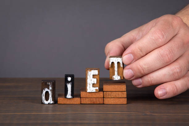istock DIET concept. Wooden alphabet letters on steps 1226107257