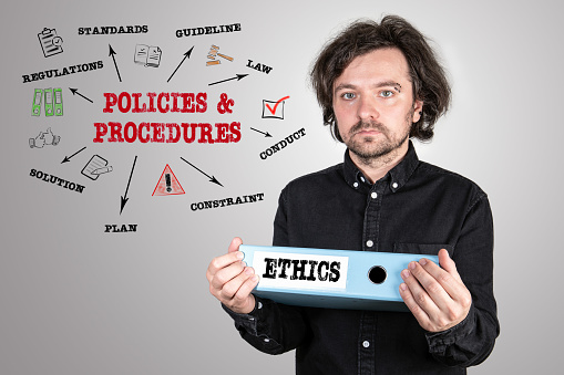 POLICIES and PROCEDURES, ETHICS Concept. Chart with keywords and icons. Office binder in the hands of man