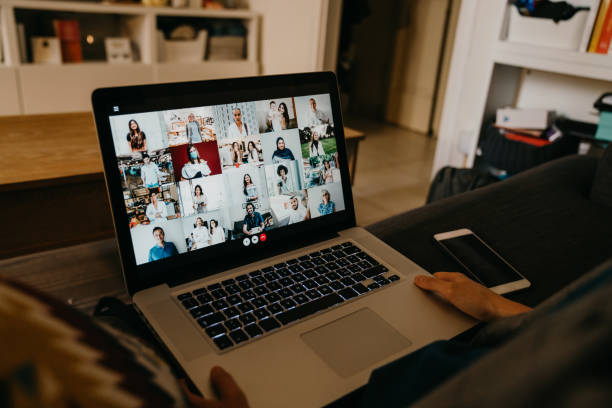 istock Young woman using a laptop on the sofa at home to have a work conference call 1226107973