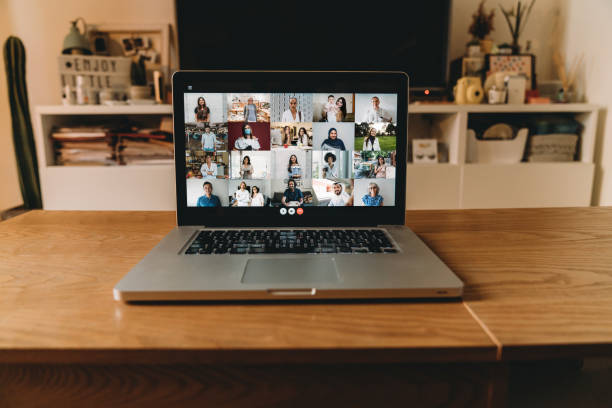 istock Laptop PC with many people having a meeting at distance 1226107976