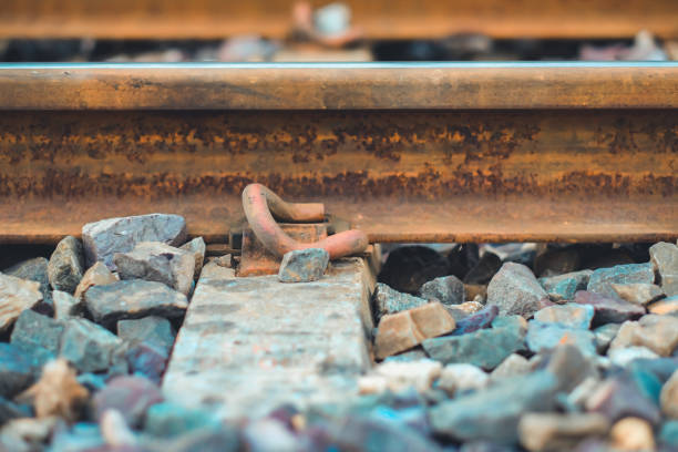 istock Closeup Bracket for railway tracks with concrete sleepers and rubble 1226108072