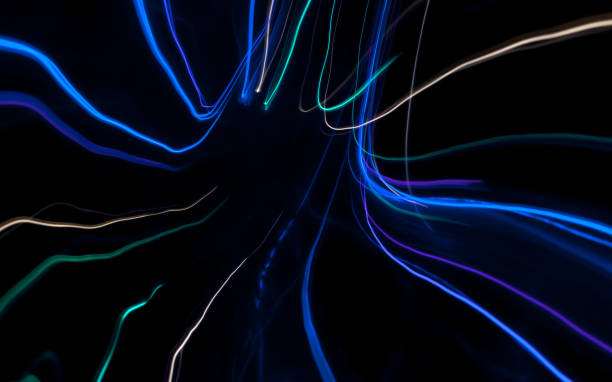 istock Light drawings on black background. Lines on a spiral 1226109656