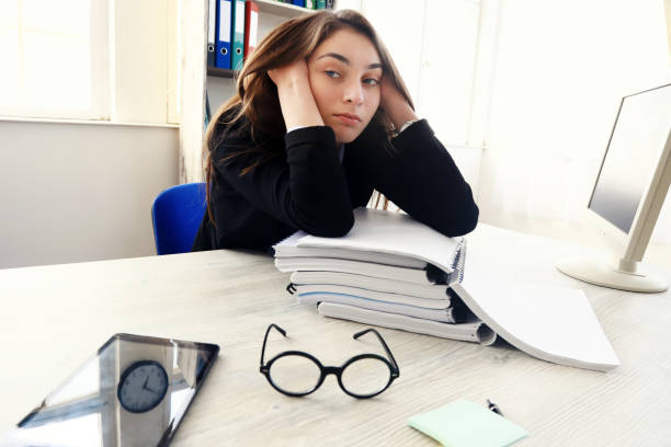 istock Tired businesswoman working in an office 1226111012