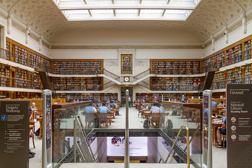 Sydney, Australia - December 30, 2019: The interior of State Library of New South Wales. State library of NSW with students and people studying and reading. The State Library of NSW is a large reference and research library open to the public. It is the oldest library in Australia.