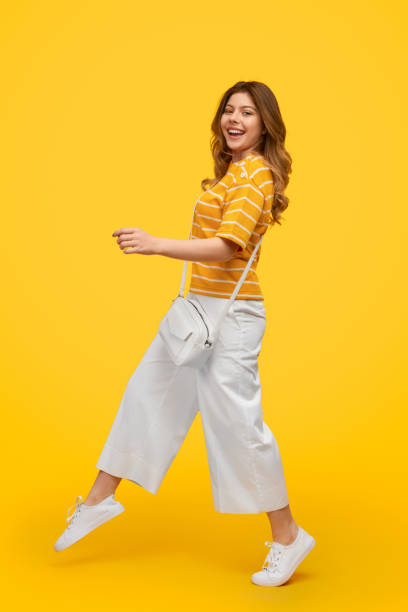 istock Stylish young woman walking and smiling 1226111110