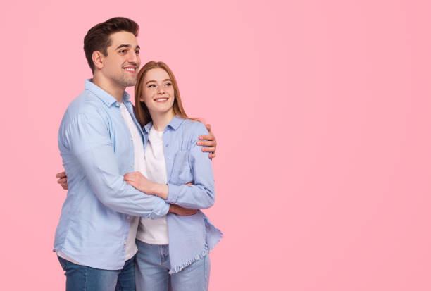 istock Dreamy couple hugging and looking away 1226111165