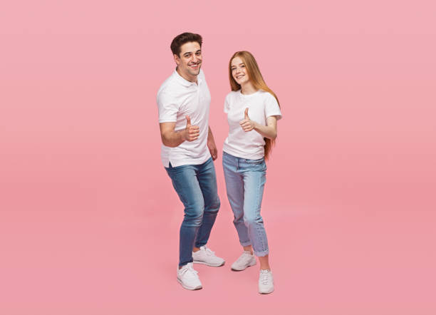 istock Happy couple gesturing thumbs up 1226111179