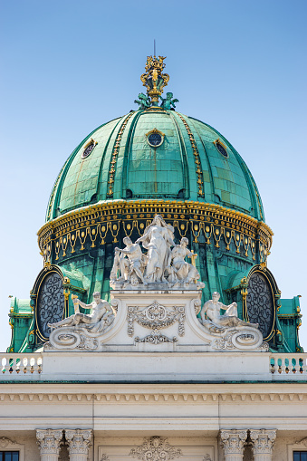 Vienna, Austria - May 29, 2020: Decorative dome of St. Michael's Wing of the Hofburg Palace in Vienna, Austria.