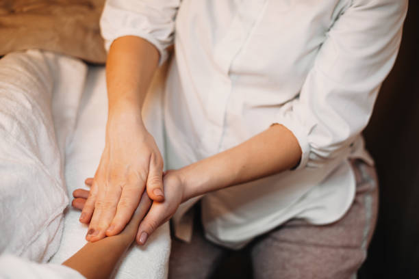 istock Upper view of a caucasian masseur having a hand massage session with the client 1226114746
