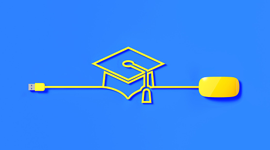 Yellow mouse cable forming graduation cap icon on blue background. Horizontal composition with copy space. Online education concept.