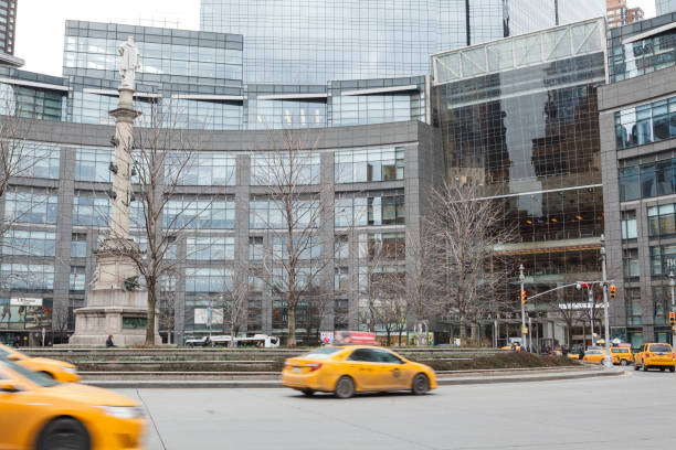 Columbus Circle New York City New York, New York, USA - February 10, 2016: Traffic and people can be seen around Columbus Circle in Manhattan on a cold Winter day. time warner center columbus circle pictures stock pictures, royalty-free photos & images