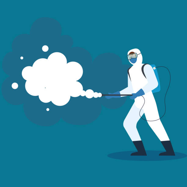istock person with protective suit or spraying viruses of covid 19, desinfection virus concept 1226124020