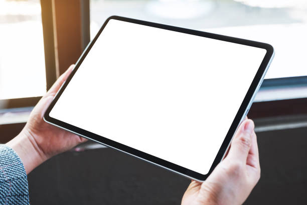 istock a woman holding black tablet pc with blank white desktop screen 1226127670