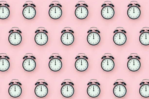 istock Pattern with black alarm clock on pink background. Minimal style Top view Template for your text, design 1226128779