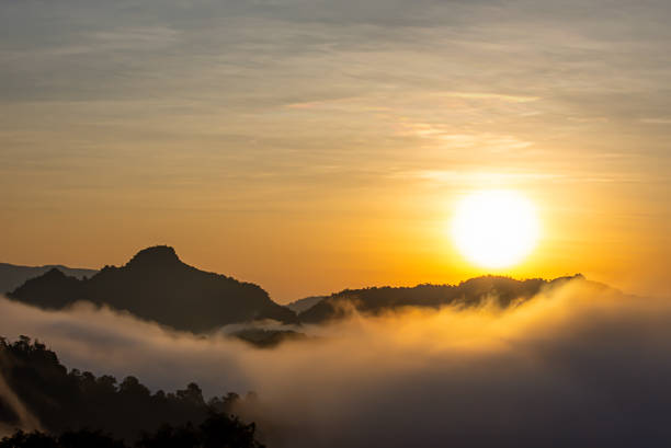 istock Sunrise and morning light behind the mountains with the mist covered. 1226129828