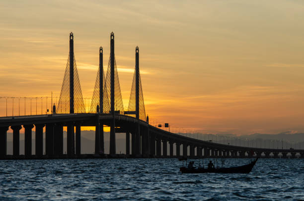 istock Silhouette fishing boat near Penang Second Bridge 1226130112