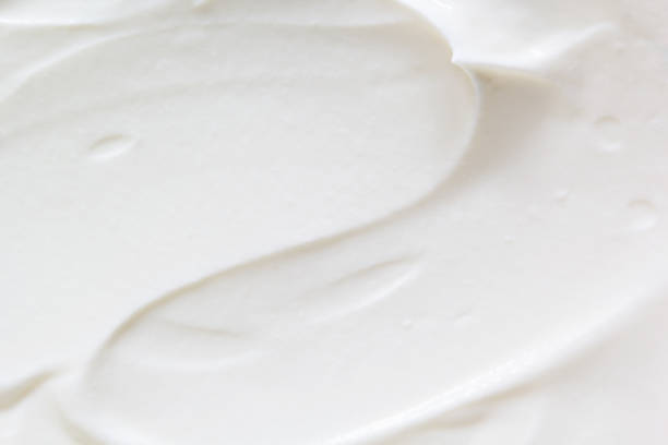 Sour cream, greek yogurt texture Sour cream, greek yogurt texture. White dairy product sample, creamy mousse closeup. Healthy natural food background cream cheese photos stock pictures, royalty-free photos & images