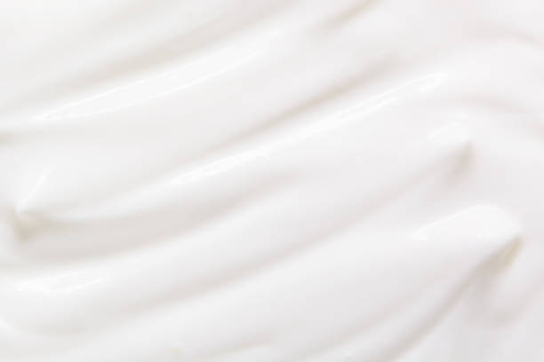 Sour cream, greek yogurt texture Sour cream, yogurt texture. White dairy food background greek yogurt photos stock pictures, royalty-free photos & images