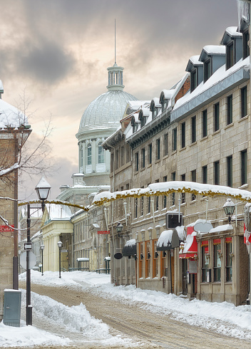St. Paul Street in Old-Montréal after a snowstorm. \nMarché Bonsecours in the background.