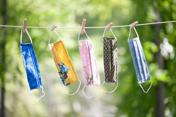 istock Homemade Protective Face Masks Hanging on Clothesline 1226133732