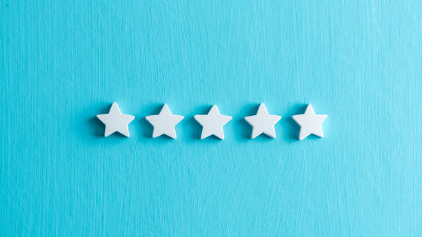 istock 5 star rating customers satisfaction, white stars on light blue background. 1226134773