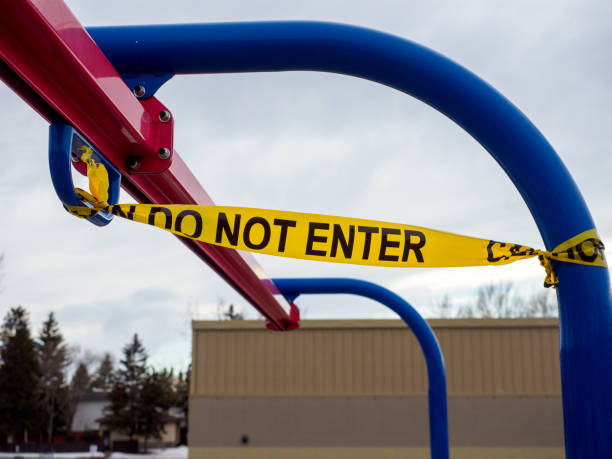 istock Close up of “Do Not Enter” Caution Tape on playground 1226134952