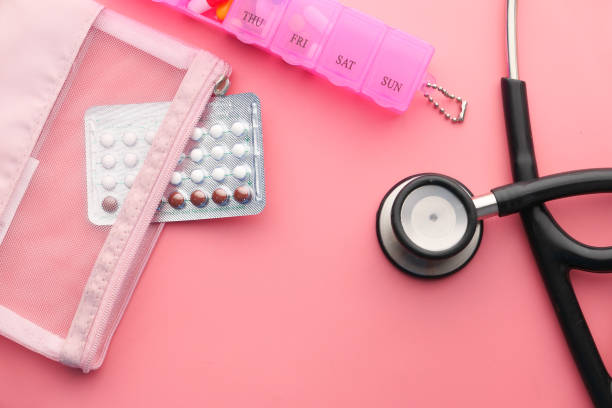birth control pills and stethoscope on pink birth control pills and stethoscope on pink . contraceptive photos stock pictures, royalty-free photos & images