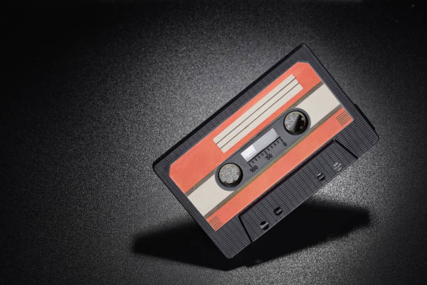 istock Black audio tape compact cassette on black background 1226137916