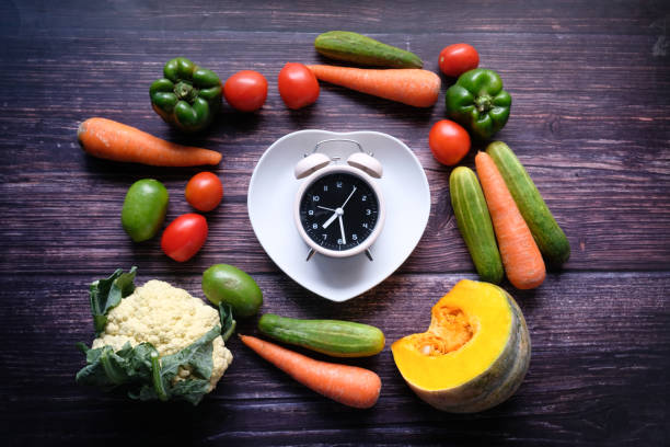 istock Food clock and fresh vegetable on table 1226139118