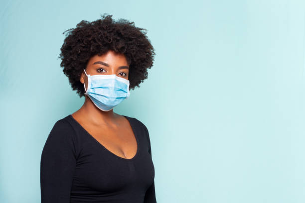 istock black woman wearing protection mask 1226143650