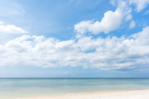 Tropical sea and beach with blue sky blurred abstract background