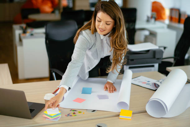 istock Young businesswoman working on project. 1226146778