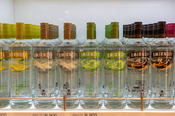 Bottles of Smirnoff vodka on a shelf in duty free shop airport in Muscat, Oman Muscat, Oman - january 19, 2020 : Bottles of Smirnoff vodka on a shelf in duty free shop airport in Muscat, Oman copyright free medical stock pictures, royalty-free photos & images