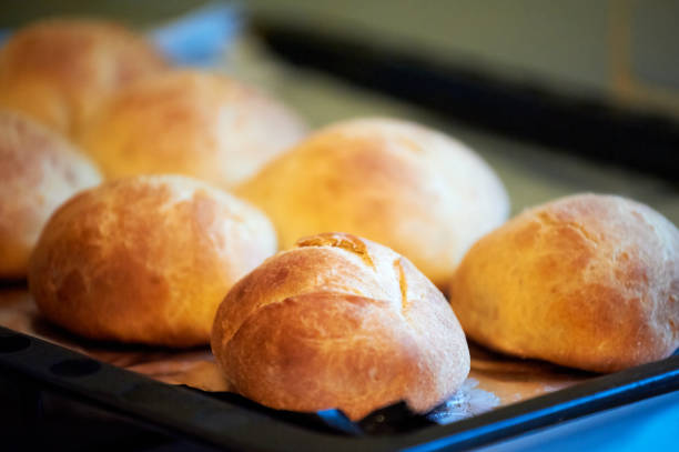 istock Freshly baked buns on a black tray 1226150109